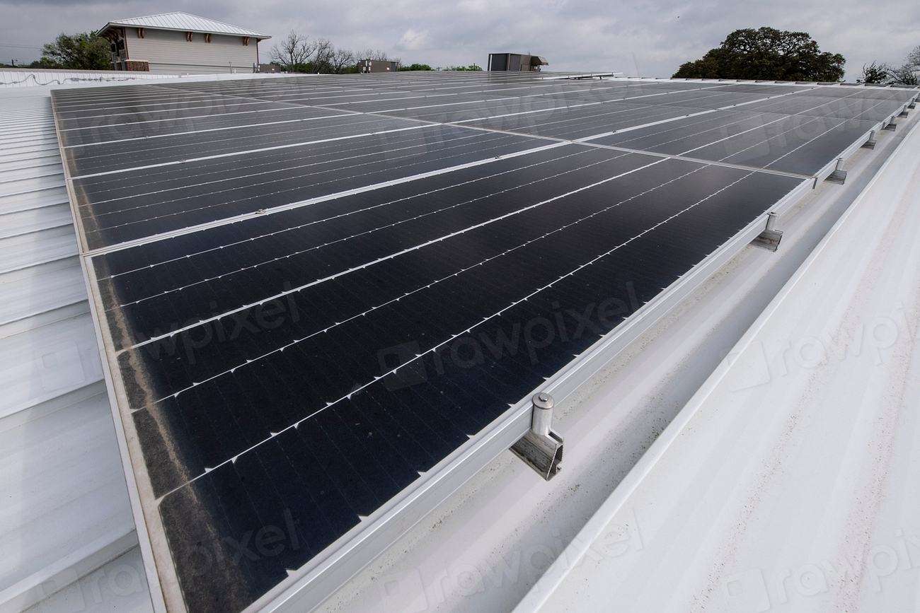Rows of solar panels on a commercial metal roof