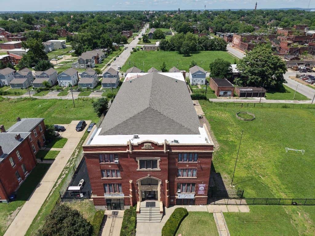 Aerial view of a commercial roof replacement on a brick building