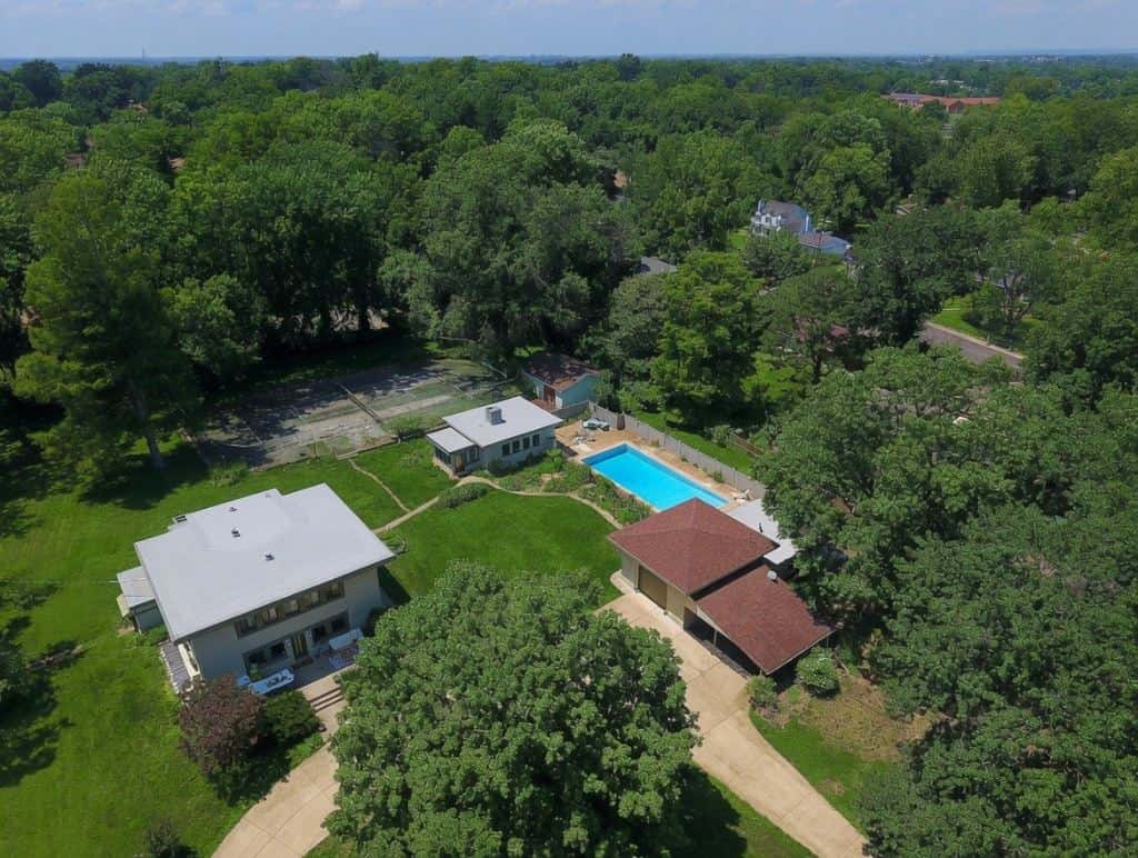 Aerial view of a home roof and backyard pool