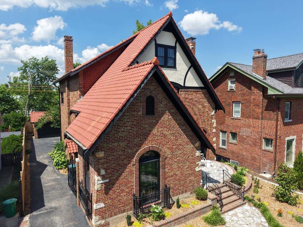 Brick Tudor home with a new red roof